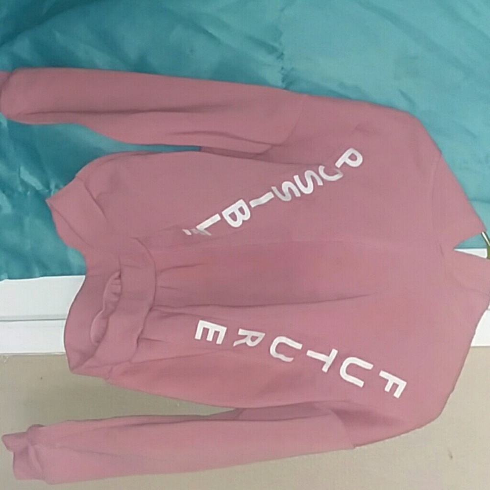 A sweater from rainbow never worn it has a hoodie